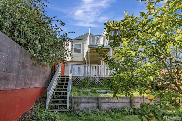 back of house with a wooden deck