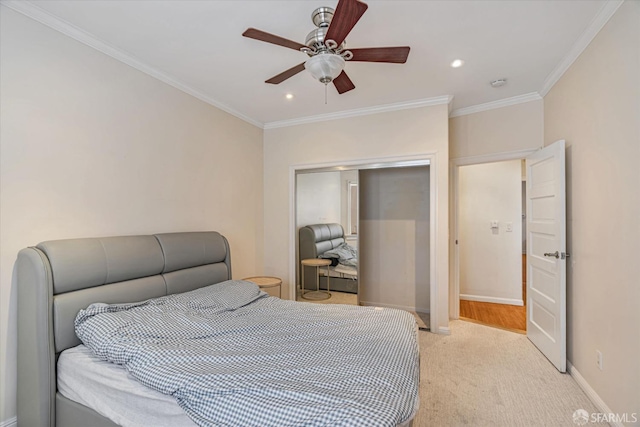 carpeted bedroom featuring a closet, ceiling fan, and crown molding