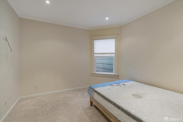 bedroom with light colored carpet and ornamental molding