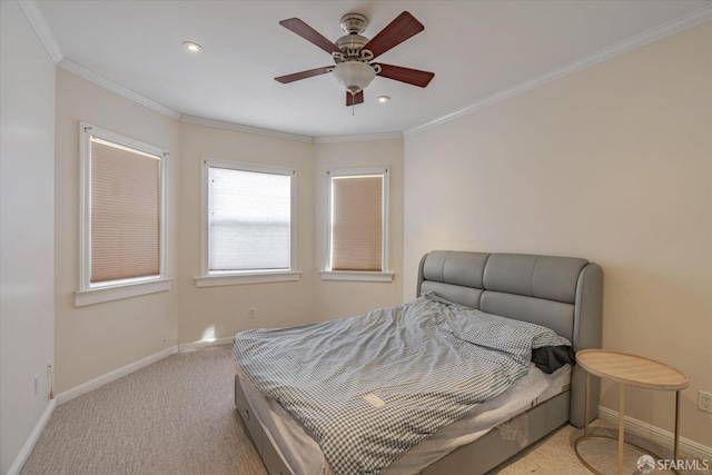 carpeted bedroom with ceiling fan and ornamental molding