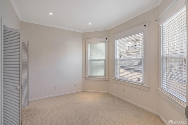 carpeted empty room with ornamental molding