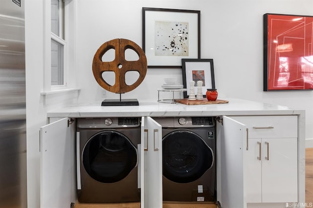 laundry room featuring laundry area and washing machine and clothes dryer