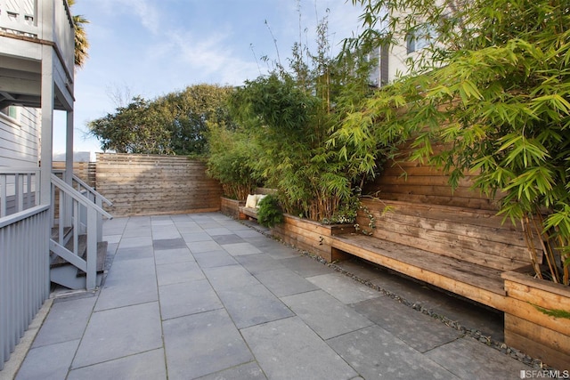 view of patio / terrace featuring fence