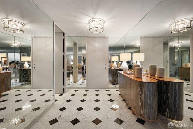 reception area featuring a chandelier