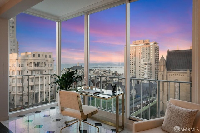 view of balcony at dusk