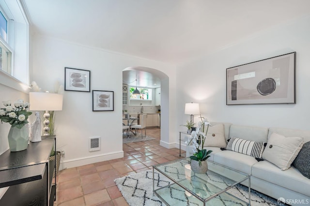 30 Eagle St, San Francisco, CA 94114 - living room featuring arched walkways and baseboards