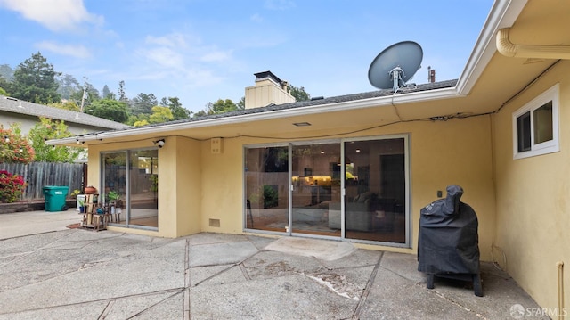 29 Woodcrest Cir, Oakland, CA 94602 - back of house with stucco siding, a patio area, and a chimney