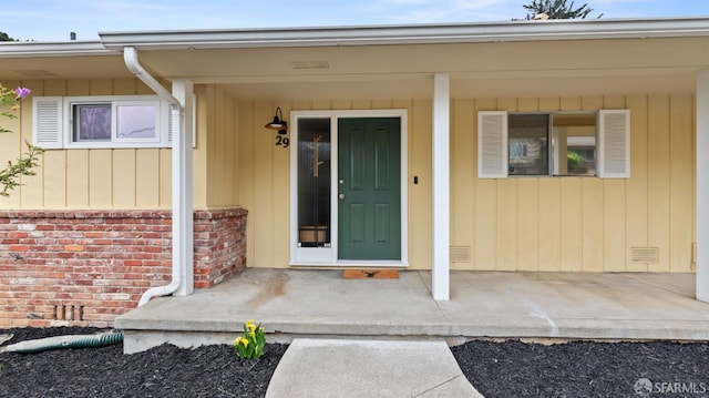 29 Woodcrest Cir, Oakland, CA 94602 - doorway to property with covered porch and brick siding