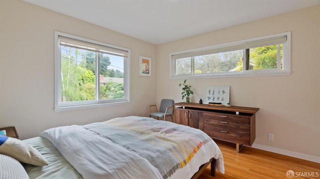 29 Woodcrest Cir, Oakland, CA 94602 - bedroom featuring multiple windows and light wood-type flooring