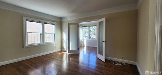 empty room with wood finished floors and baseboards