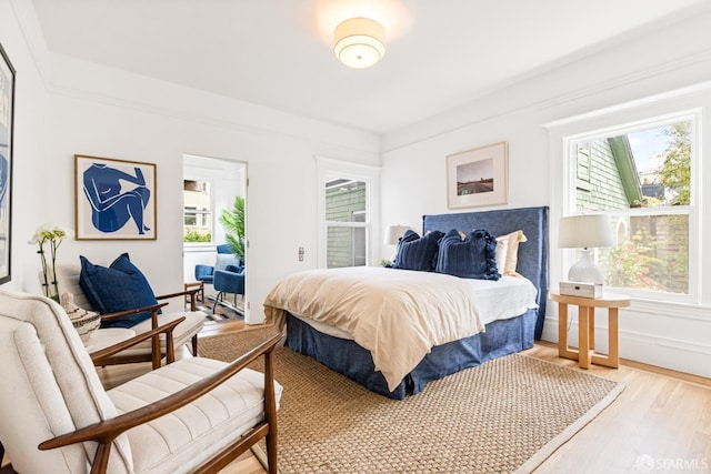 276 Funston Ave, San Francisco, CA 94118 - bedroom with multiple windows, light wood-style flooring, and baseboards