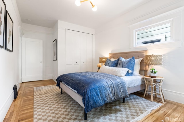 276 Funston Ave, San Francisco, CA 94118 - bedroom featuring light wood finished floors, baseboards, and a closet