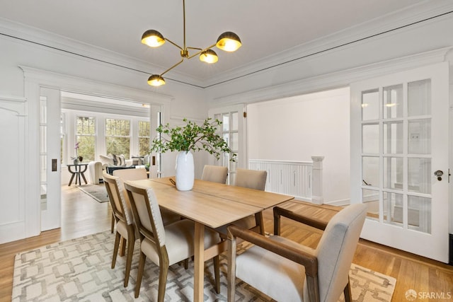 276 Funston Ave, San Francisco, CA 94118 - dining space with light wood finished floors, ornamental molding, and a chandelier