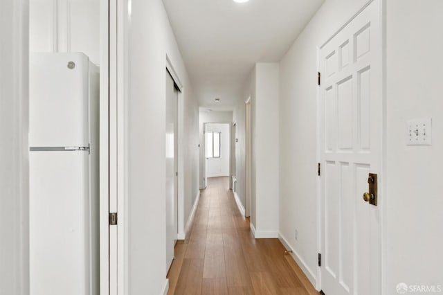 hallway featuring light wood-type flooring