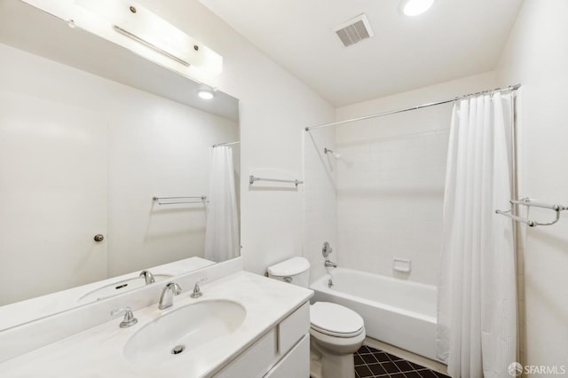 full bathroom with tile patterned flooring, vanity, shower / bath combo with shower curtain, and toilet