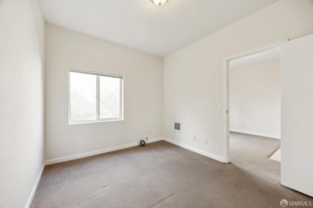 unfurnished room featuring carpet floors