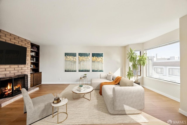 living room featuring hardwood / wood-style flooring and a fireplace