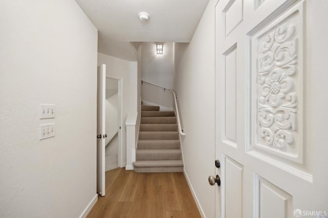 stairway featuring hardwood / wood-style floors