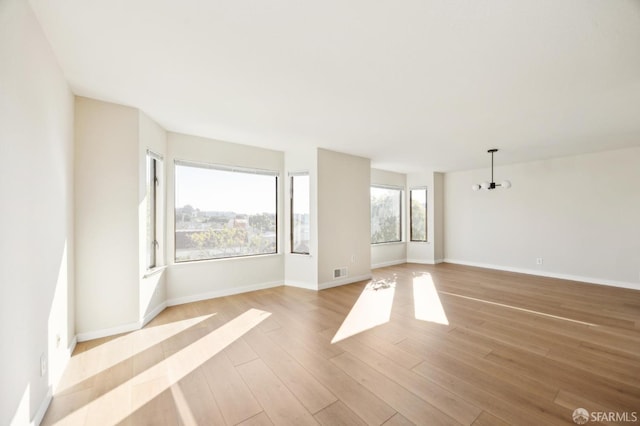 spare room with light wood-type flooring