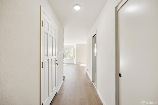 corridor featuring hardwood / wood-style flooring