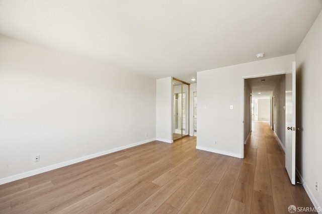 unfurnished room with light hardwood / wood-style flooring