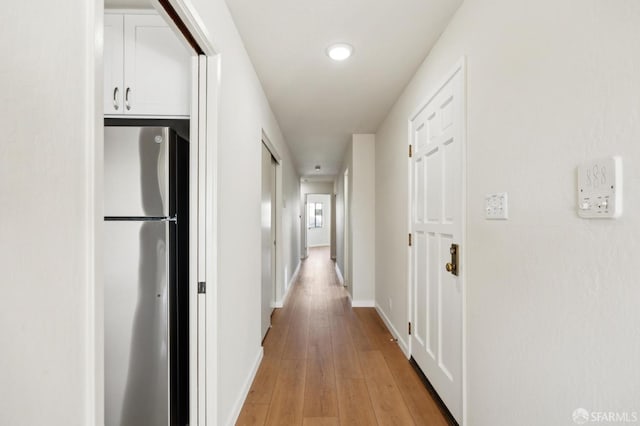 hallway featuring light wood-type flooring