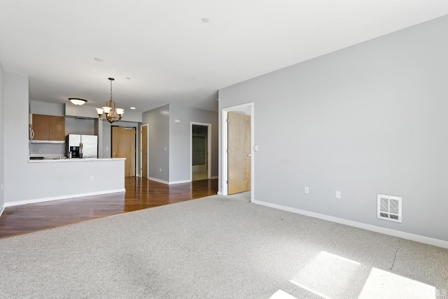 5800 3rd St Unit 1401, San Francisco, CA 94124 - unfurnished living room with carpet flooring and a chandelier