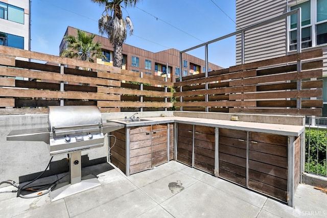 5800 3rd St Unit 1401, San Francisco, CA 94124 - view of patio with a sink and a grill