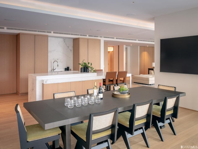 dining area featuring light wood-type flooring