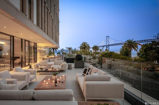 exterior space with an outdoor hangout area and a balcony