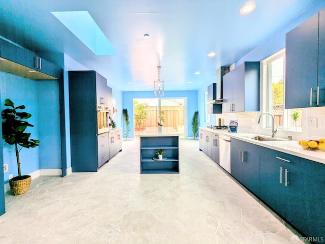 kitchen featuring a sink, stainless steel appliances, open shelves, wall chimney exhaust hood, and light countertops