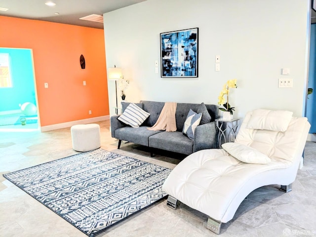 living room featuring baseboards