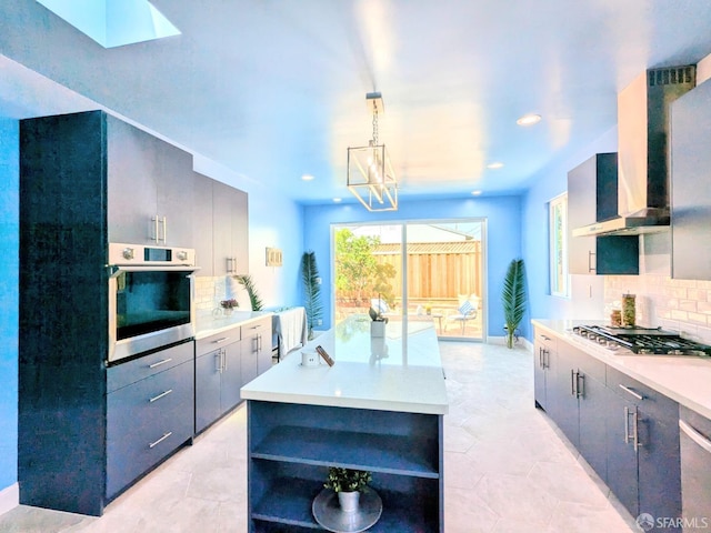 kitchen featuring light countertops, open shelves, appliances with stainless steel finishes, and tasteful backsplash