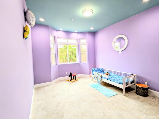 bedroom with recessed lighting and baseboards