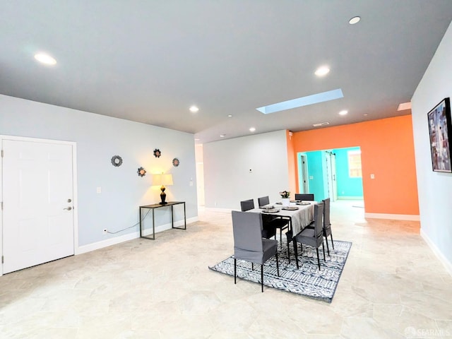 dining area featuring a skylight