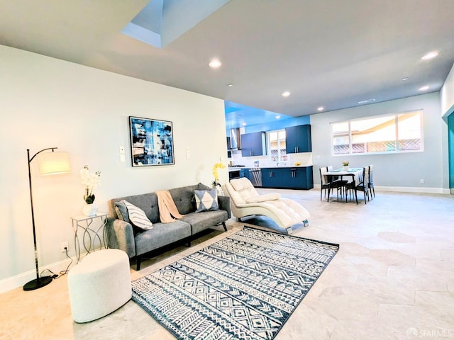 living area with recessed lighting and baseboards