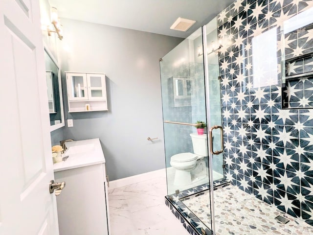 full bathroom featuring toilet, marble finish floor, a shower stall, and vanity