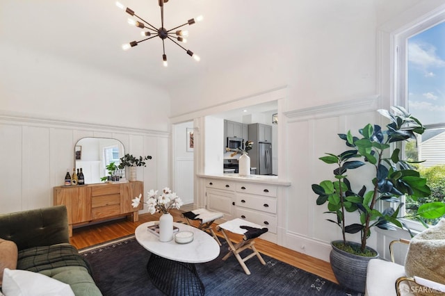 living room featuring a notable chandelier and hardwood / wood-style flooring