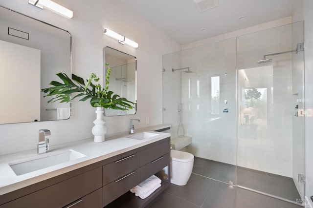 full bath featuring a shower with door, a sink, toilet, and double vanity