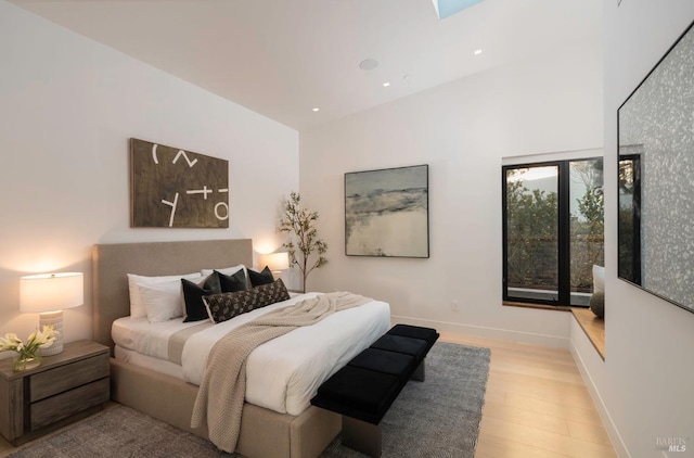 bedroom with light wood-type flooring, baseboards, and recessed lighting