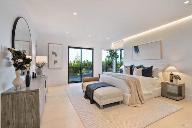 bedroom with access to exterior, recessed lighting, light wood-type flooring, and baseboards