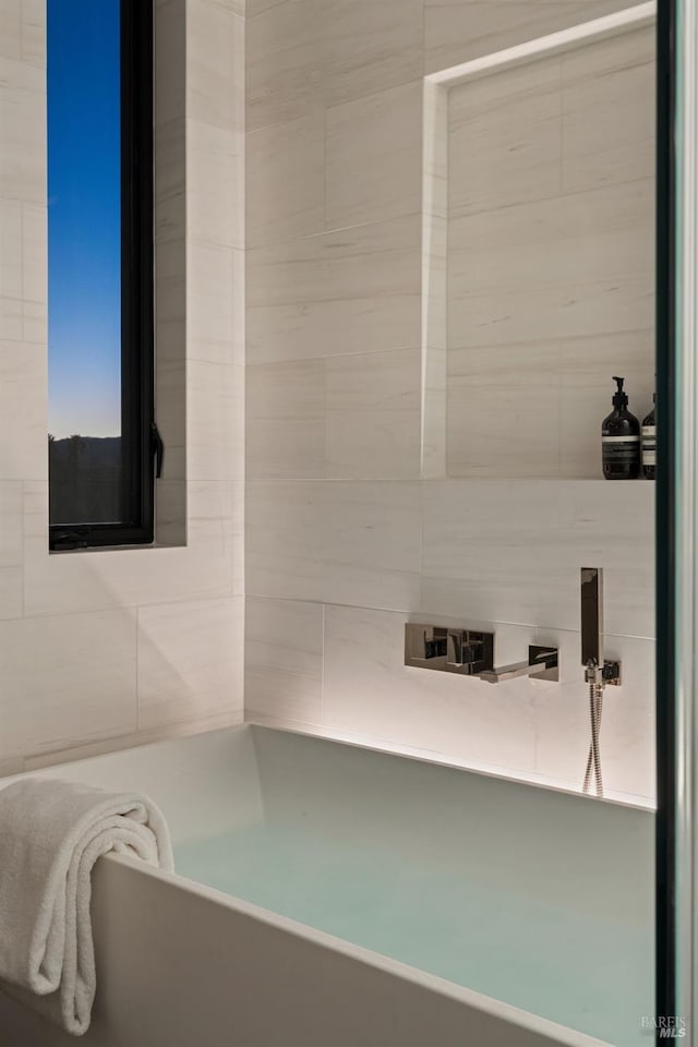 full bath with a freestanding bath