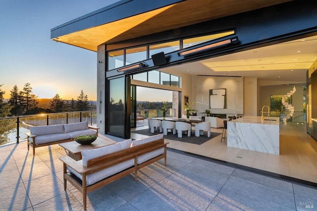 patio terrace at dusk with outdoor lounge area