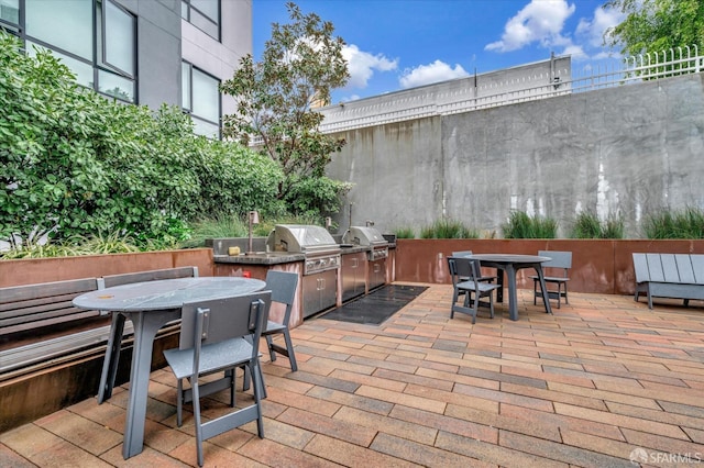 view of patio featuring area for grilling and an outdoor kitchen