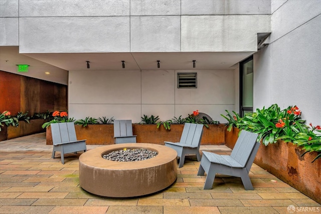 view of patio / terrace with an outdoor fire pit