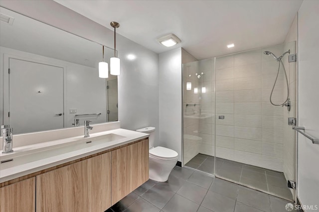 bathroom featuring walk in shower, vanity, toilet, and tile patterned floors