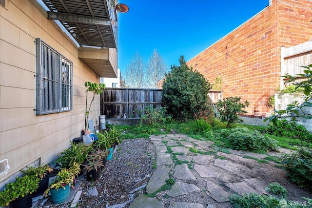 view of yard featuring a patio area and a fenced backyard