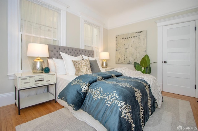 bedroom with wood finished floors