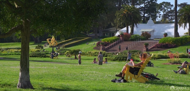 view of home's community with a yard