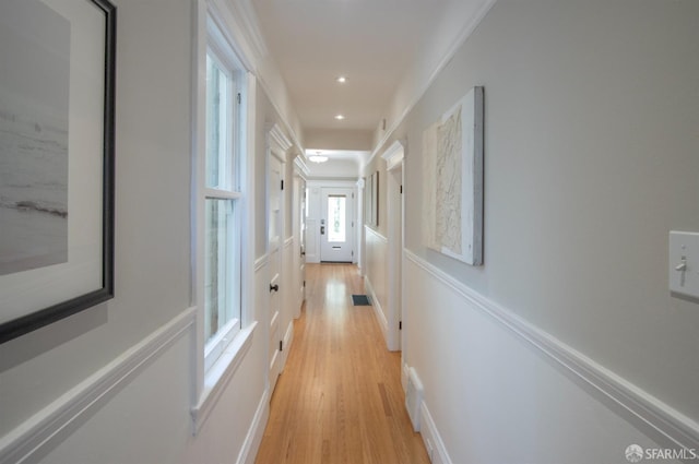 hall with light wood-style flooring and recessed lighting